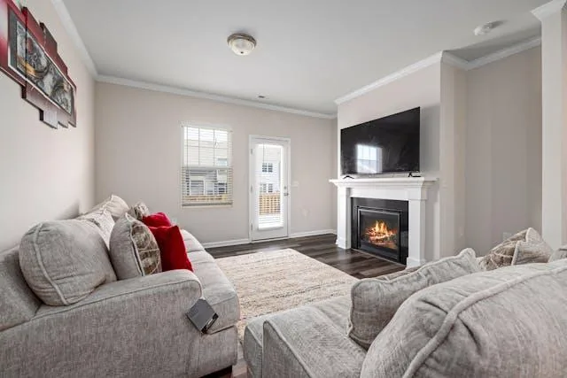 Grey couch in front of a fireplace in a Mt. Helix rental home