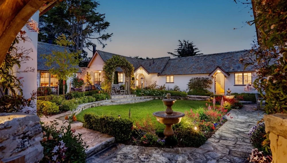 Penny Realty managed residential property with a landscaped courtyard and fountain