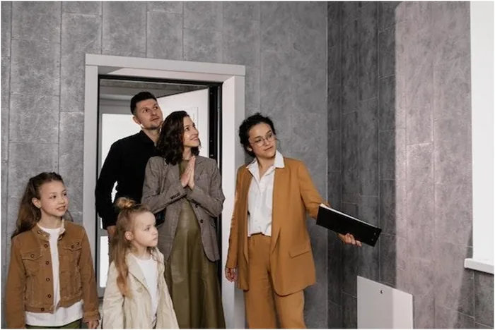 Real estate agent showing property